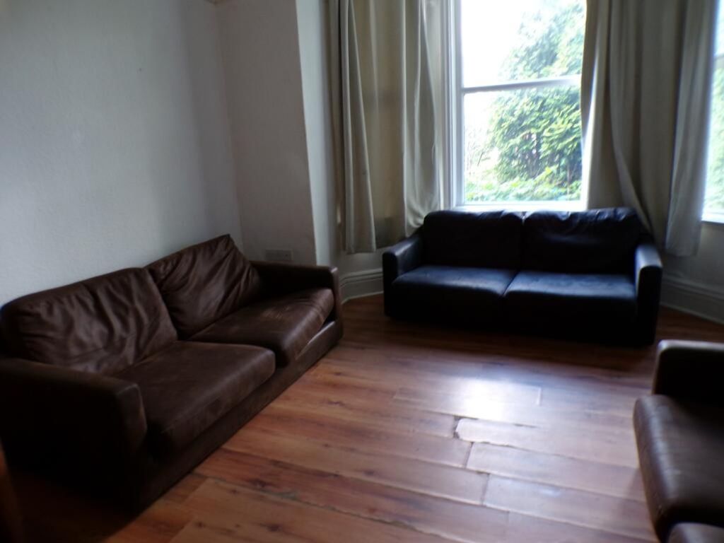 Property photo 3 of 10 Spacious Living Room Featuring Comfortable Seating...