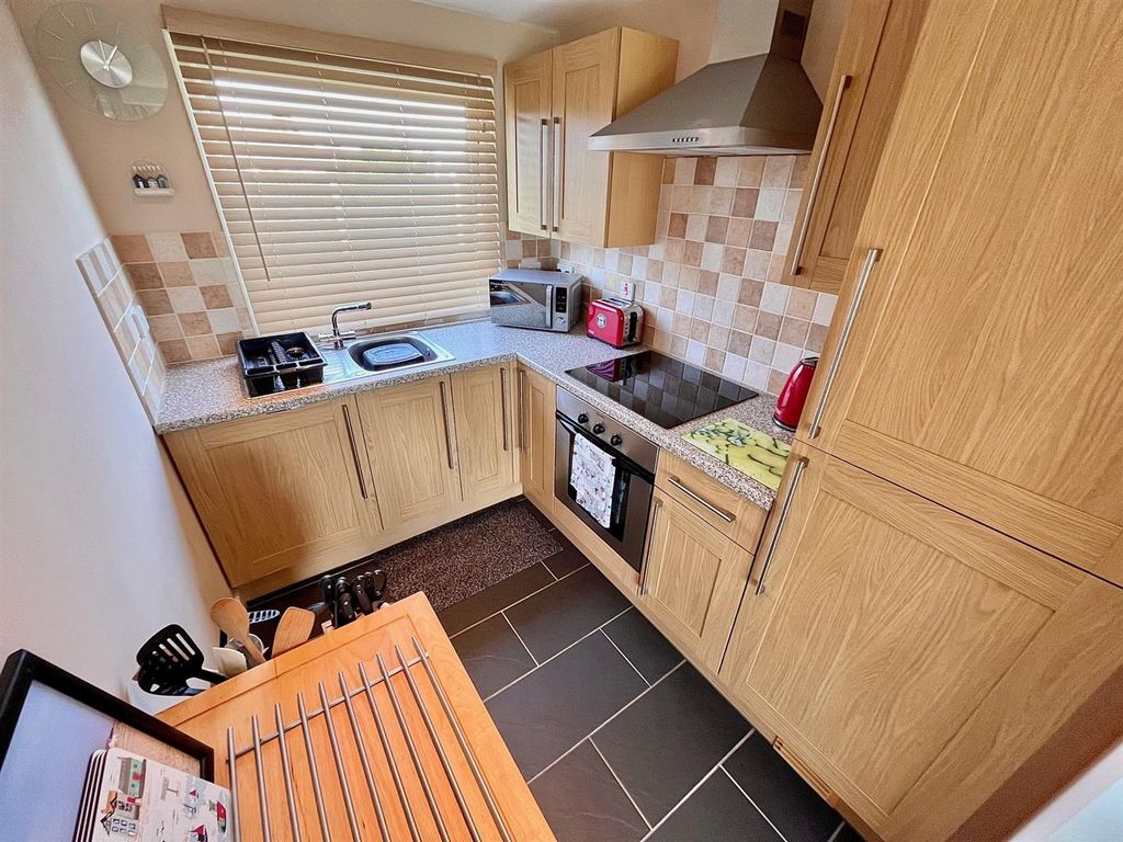 Property photo 3 of 8 Kitchen Area
