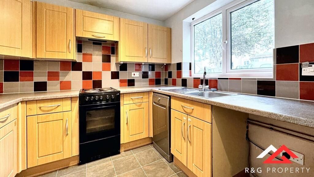 Property photo 2 of 10 Bright And Well-Maintained Kitchen Featuring Ample...