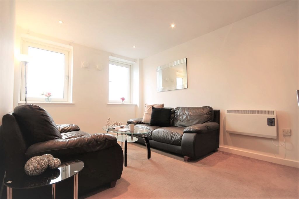Property photo 3 of 15 A Cozy Living Room Featuring Comfortable Leather S...