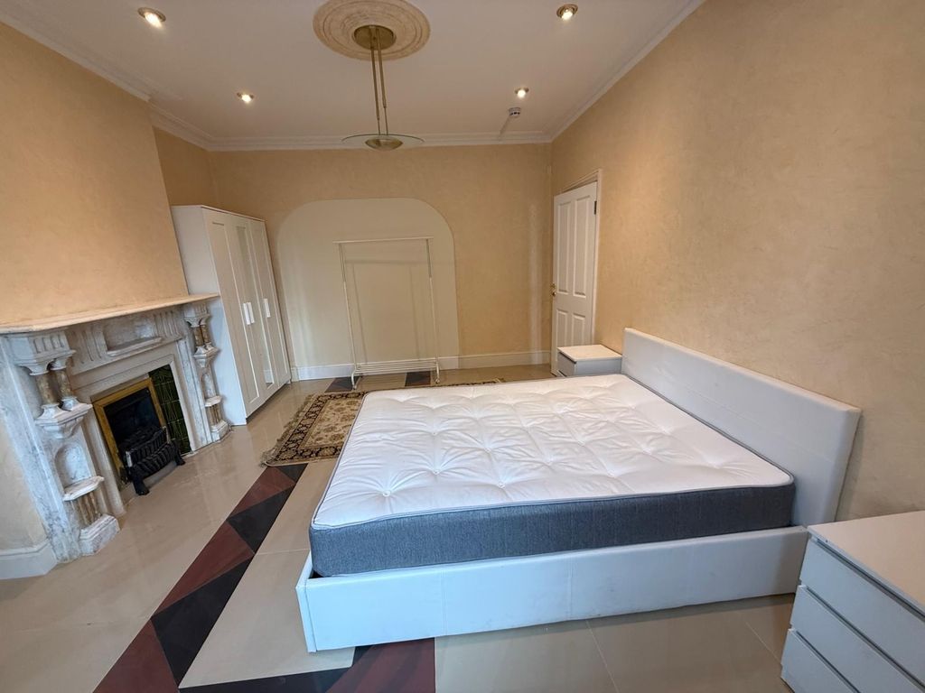 Property photo 3 of 4 Spacious Master Bedroom With Elegant Fireplace...