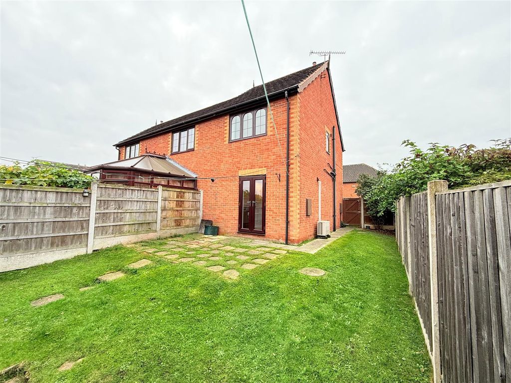 Property photo 2 of 11 Side And Rear Garden