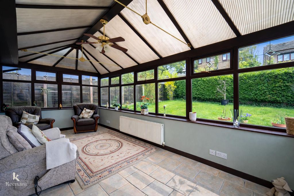 Property photo 3 of 21 Sunlit Conservatory With Lush Garden View.Png