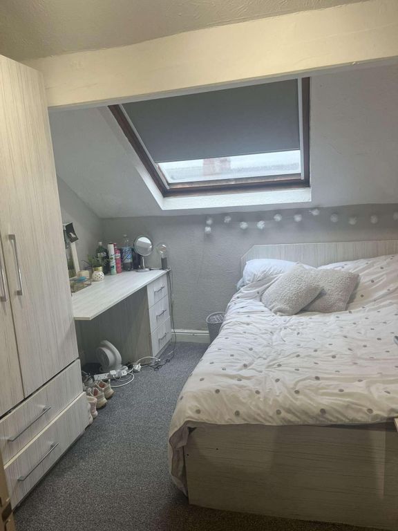 Property photo 1 of 20 A Cozy And Bright Bedroom Featuring A Large Bed, A...