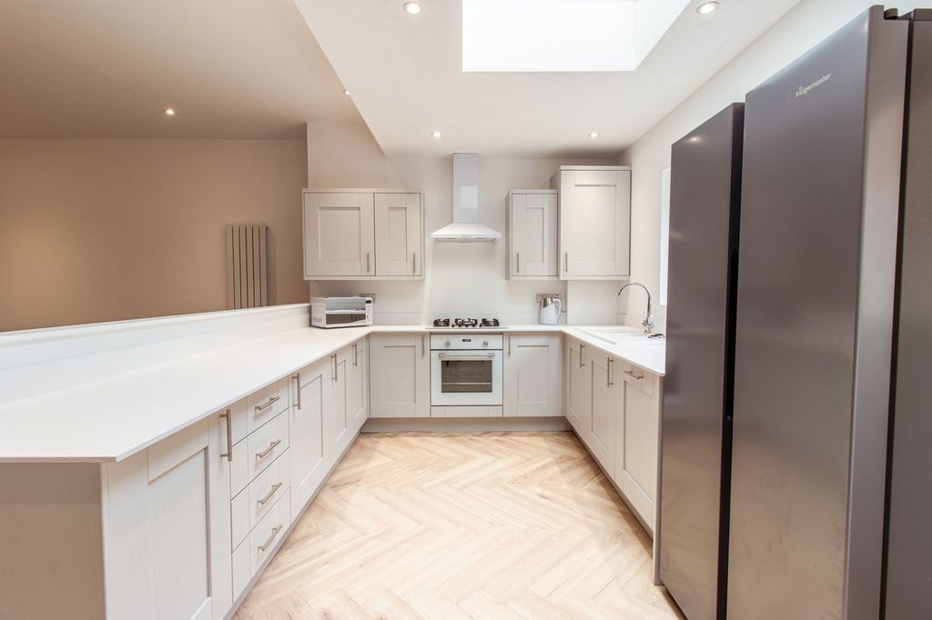 Property photo 1 of 28 Bright, Modern Kitchen With A U-Shaped Layout, Lig...