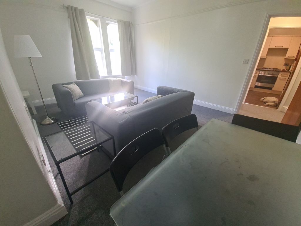 Property photo 1 of 9 Bright And Welcoming Living Room Featuring Comfort...