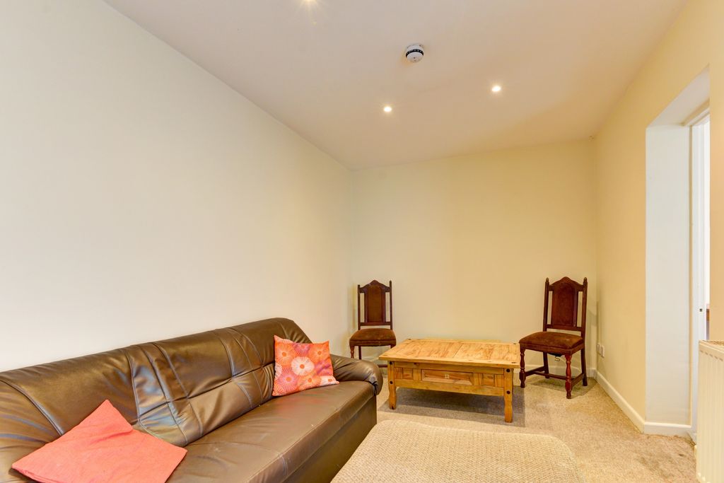 Property photo 2 of 18 Bright And Welcoming Living Room Featuring A Comfo...