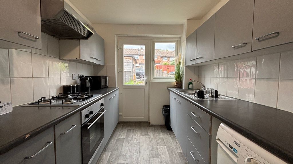 Property photo 2 of 10 Modern Grey Kitchen With Ample Storage And Light...