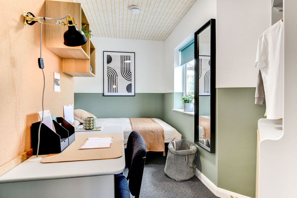 Property photo 1 of 6 This Stylish Double Bedroom Features A Cozy Bed An...