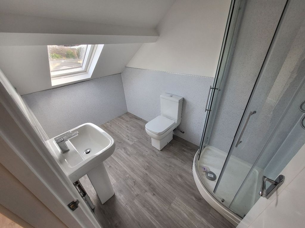 Property photo 3 of 11 Modern Bathroom Featuring A Sleek Shower And Conte...