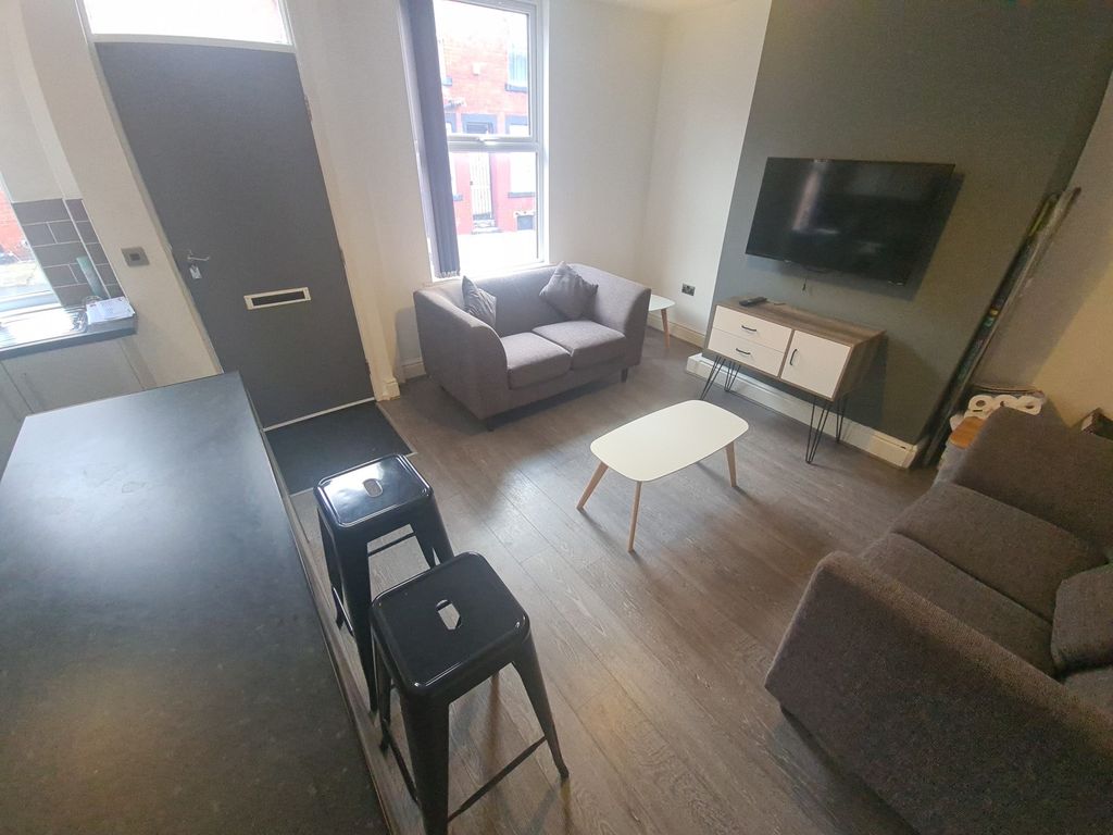 Property photo 3 of 10 A Modern And Inviting Living Room With Comfortable...