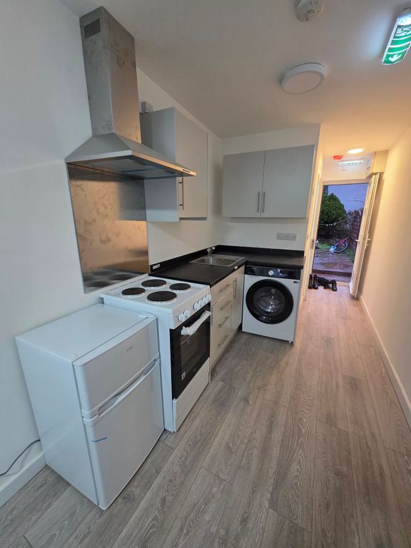Property photo 3 of 5 Modern Galley Kitchen With Laminate Wood Flooring,...