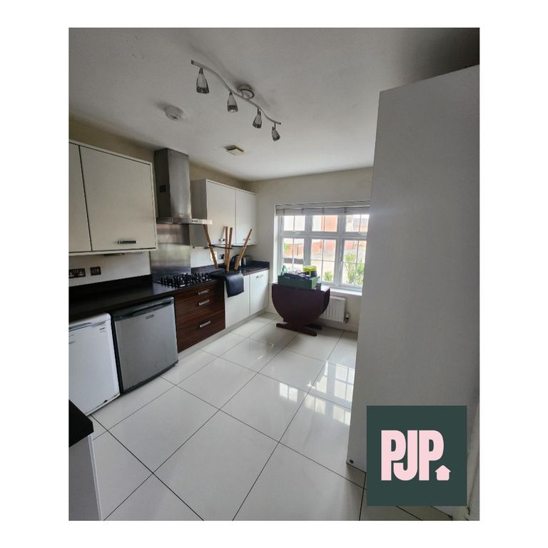 Property photo 3 of 13 A Spacious And Modern Kitchen Filled With Natural ...