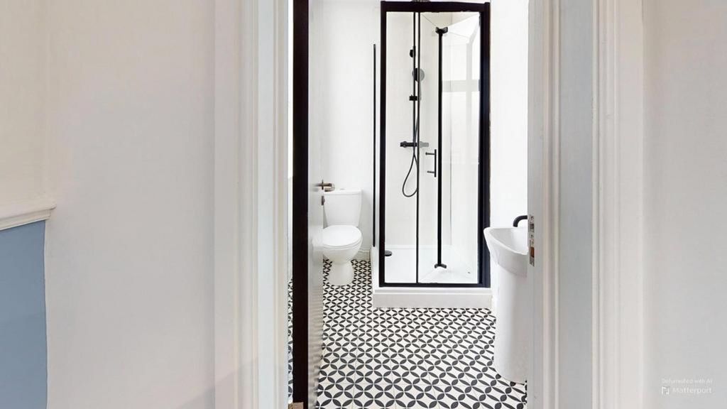 Property photo 2 of 23 A Modern And Stylish Bathroom Featuring A Spacious...