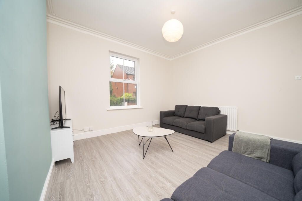 Property photo 3 of 10 A Bright And Inviting Living Room Featuring Modern...