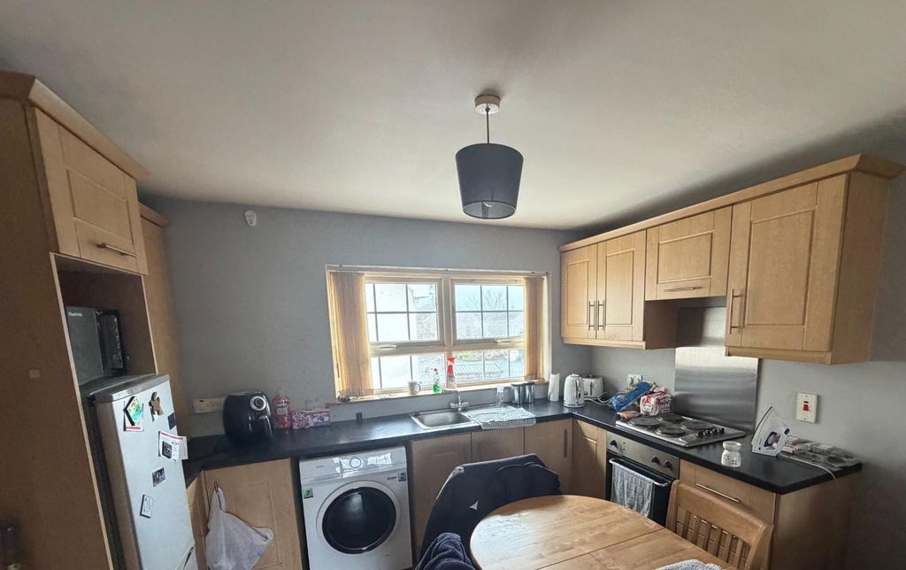 Property photo 1 of 6 Kitchen/Dining/Living