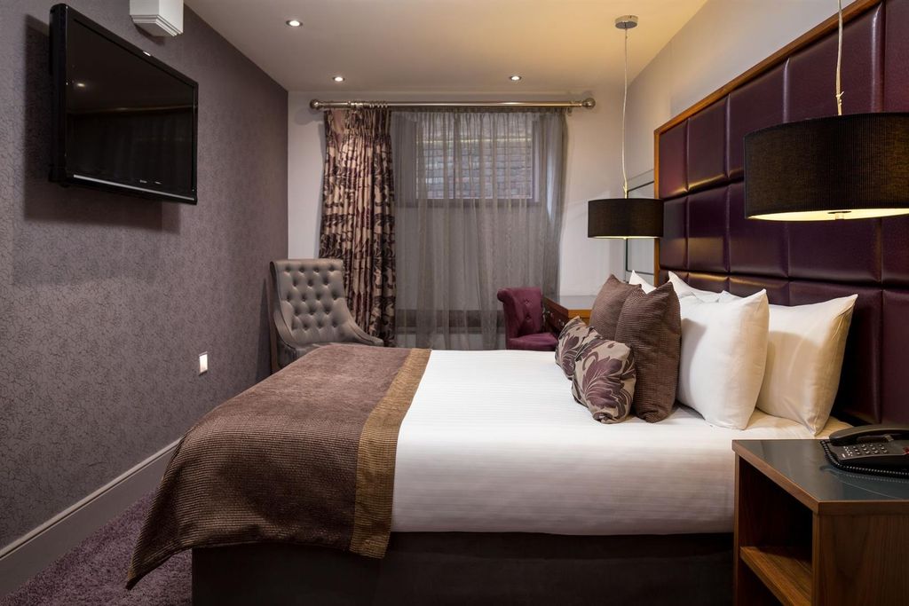 Property photo 1 of 4 Stylish Master Bedroom With Integrated Media Wall...