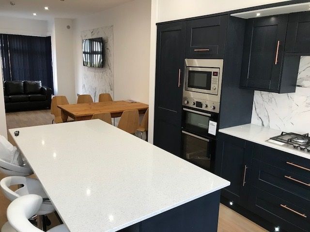 Property photo 2 of 6 Modern, Well-Maintained Kitchen With Sleek Dark Ca...