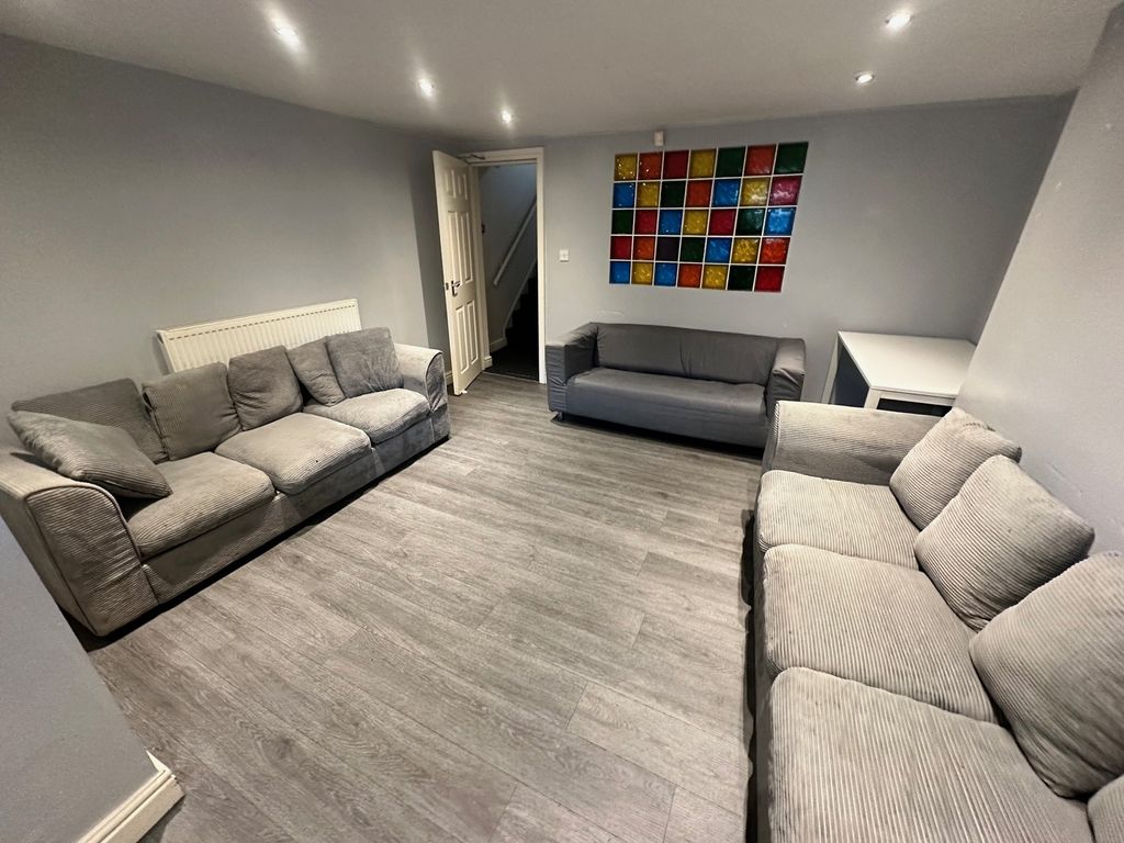 Property photo 1 of 5 Spacious And Inviting Living Room Featuring Comfor...