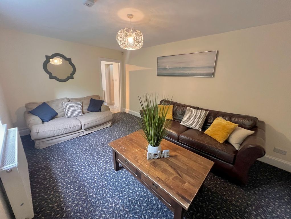 Property photo 3 of 16 A Spacious And Inviting Living Room Perfect For So...