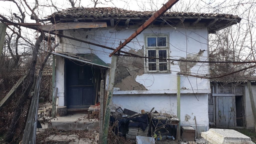 Property photo 2 of 46 Close-Up Of The Front Entrance Of A Traditional Bulgarian House Showing Peeling Plaster And A Dark Blue Door