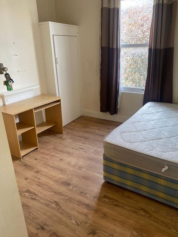 Property photo 3 of 5 Bright Bedroom With Desk And Wood Floor...