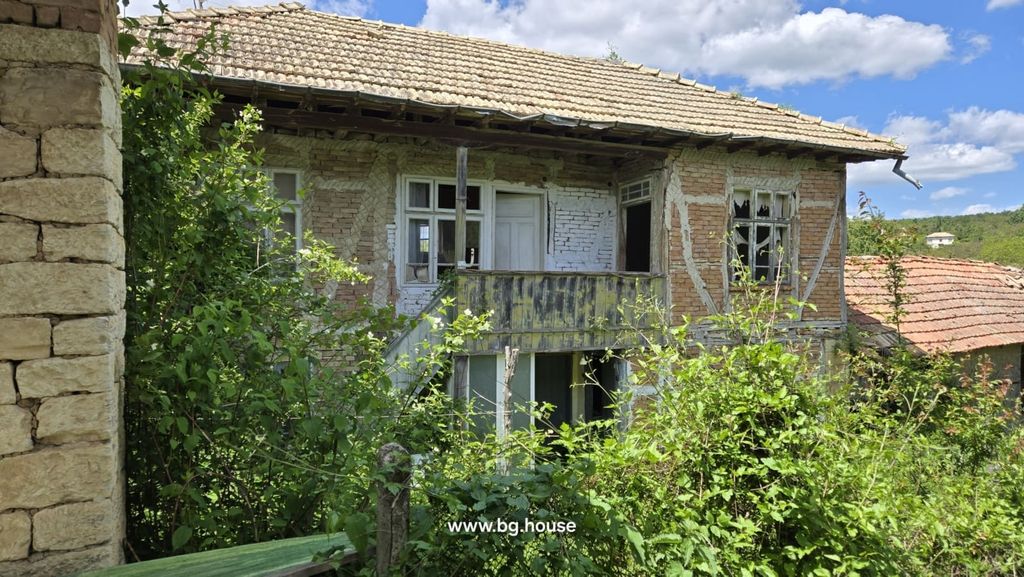 Property photo 2 of 42 Two-Storey Brick House With External Wooden Stairs And Broken Windows Surrounded By Plants