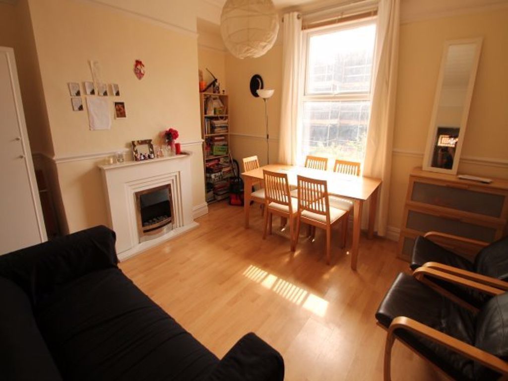 Property photo 1 of 5 Bright And Welcoming Living Room Featuring Natural...