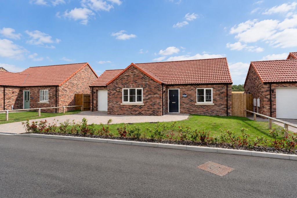 Property photo 1 of 19 Modern Brick Homes With Tidy Landscaping.Png