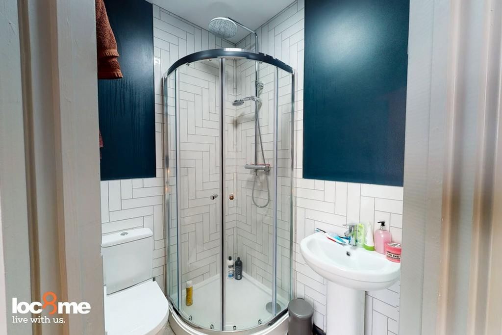 Property photo 1 of 8 A Modern And Clean Bathroom Featuring A Stylish Sh...