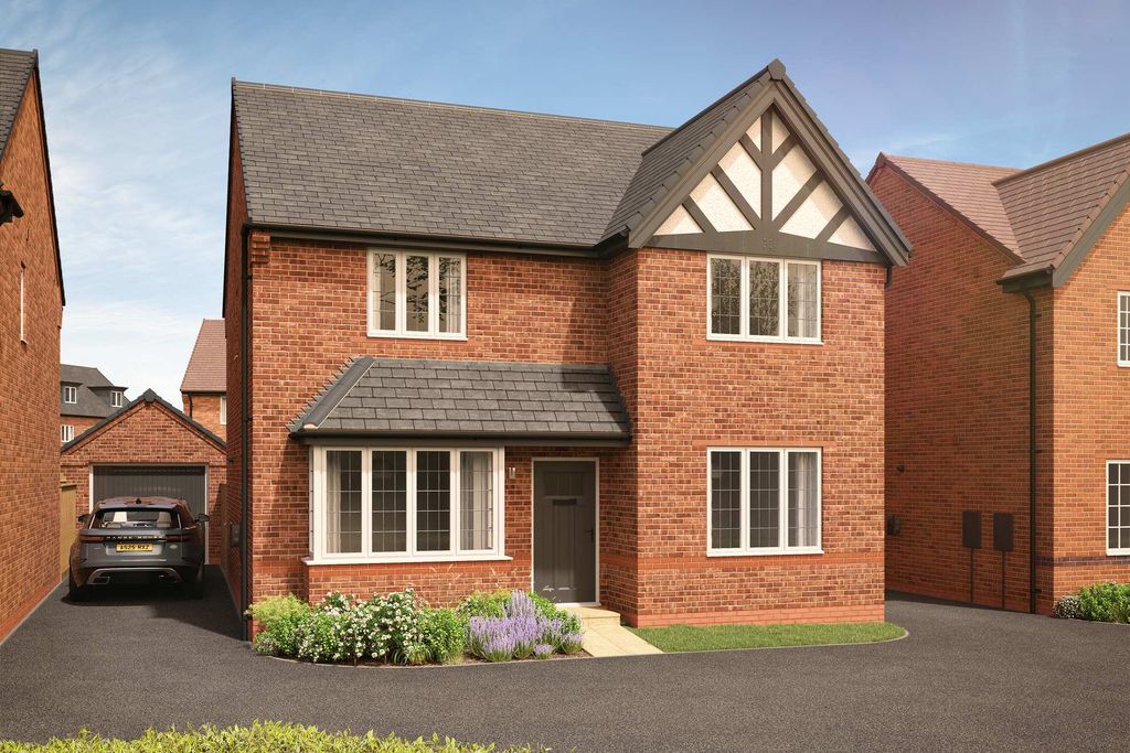 Property photo 1 of 11 A Modern Brick House With A Dark Roof And White-Trimmed Windows Stands On A Paved Driveway With A Ca