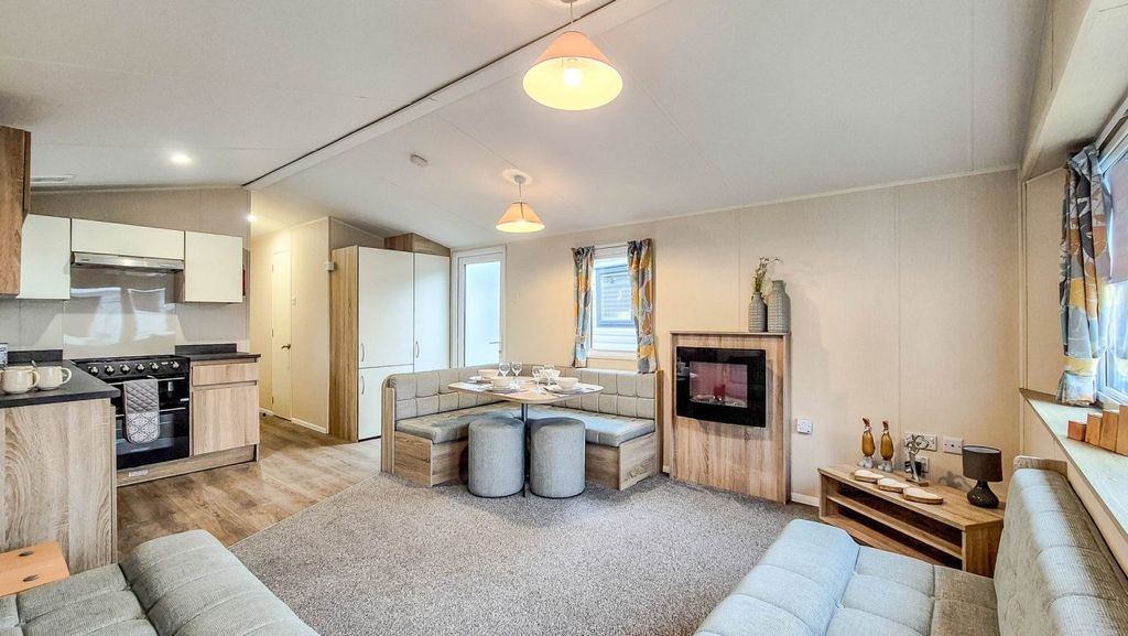 Property photo 3 of 16 Open Plan Living Area With Dining Table & Benches In The Willerby Etchingham Holiday Caravan For Sale At Polperro Holiday Park, Cornwall