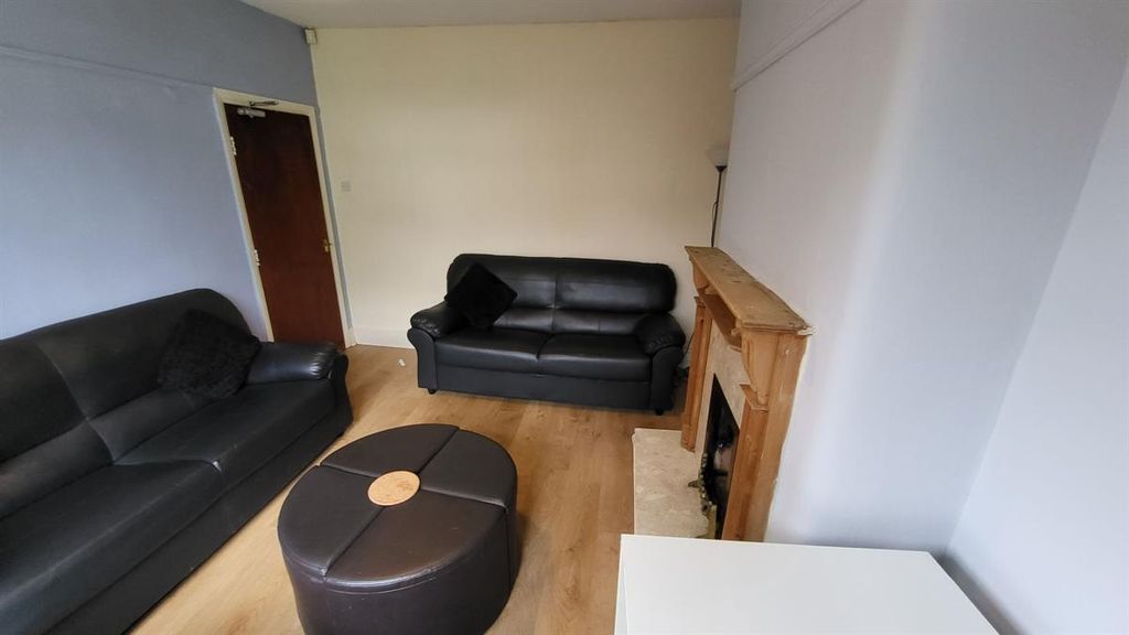 Property photo 1 of 13 A Modern Living Room Featuring Spacious Seating Wi...