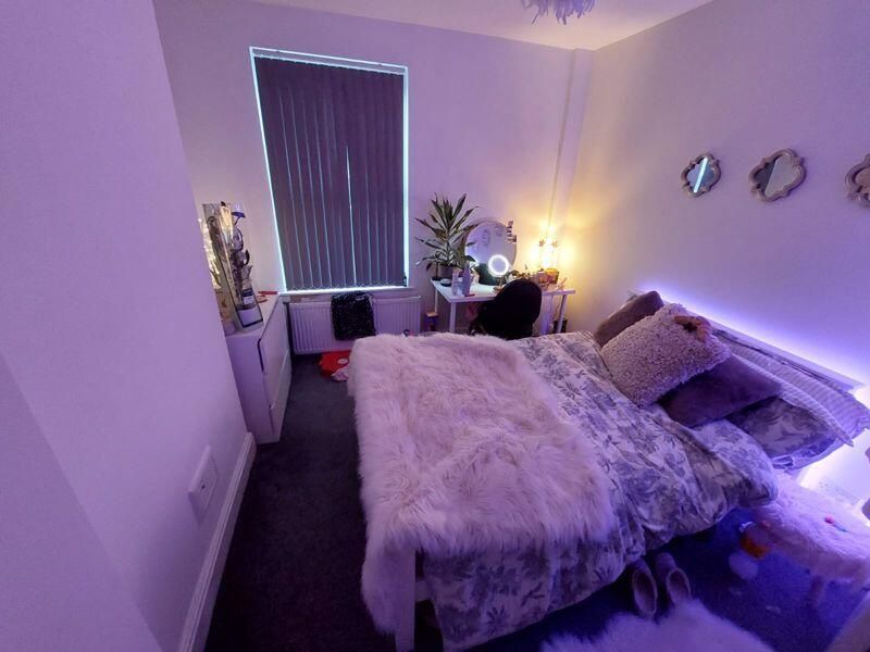 Property photo 2 of 9 A Spacious Master Bedroom Featuring A Comfortable ...