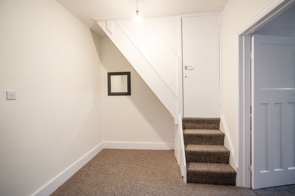 Property photo 1 of 14 Neat Entrance Area With Carpeted Stairs, Neutral W...