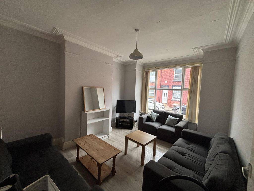 Property photo 2 of 9 A Bright And Inviting Living Room Featuring Comfor...