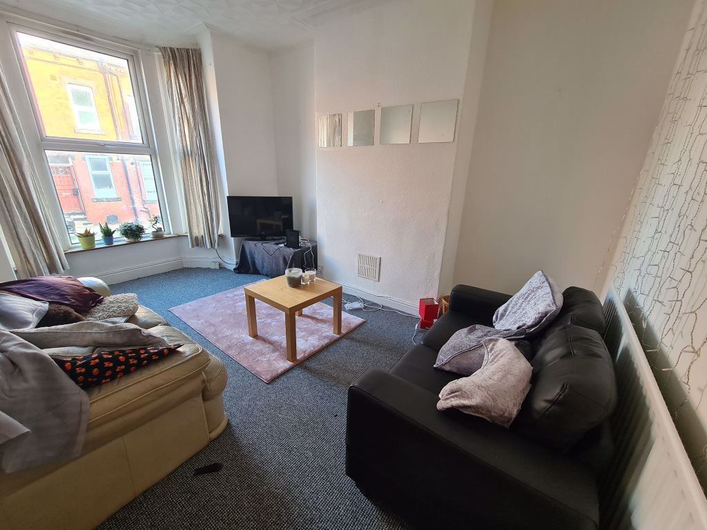 Property photo 3 of 28 A Welcoming Living Room With Abundant Natural Ligh...