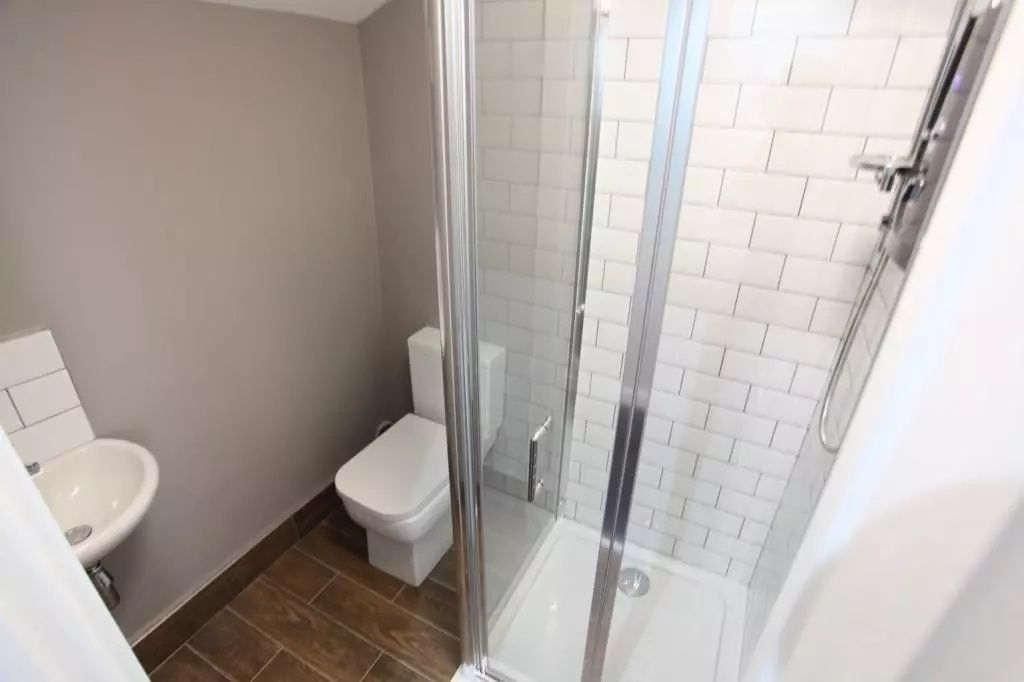 Property photo 2 of 12 A Modern And Tidy Bathroom Featuring A Glass-Enclo...
