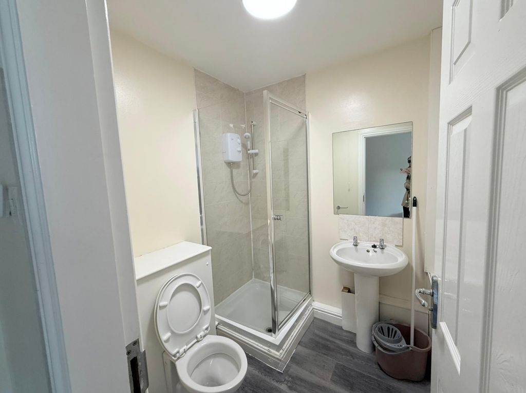 Property photo 3 of 14 A Clean And Functional Bathroom Featuring A Corner...