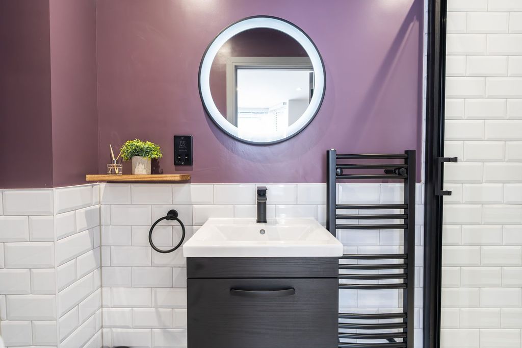 Property photo 2 of 34 Modern Bathroom Featuring A Sleek White Sink With ...
