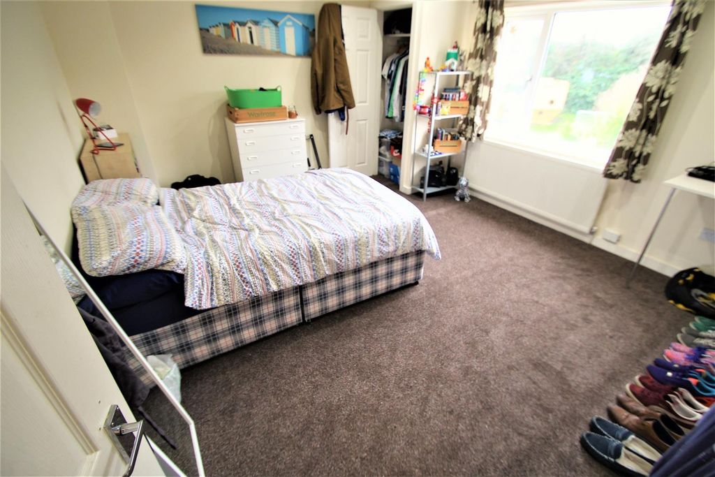 Property photo 1 of 9 Bright And Welcoming Living Room With Ample Natura...