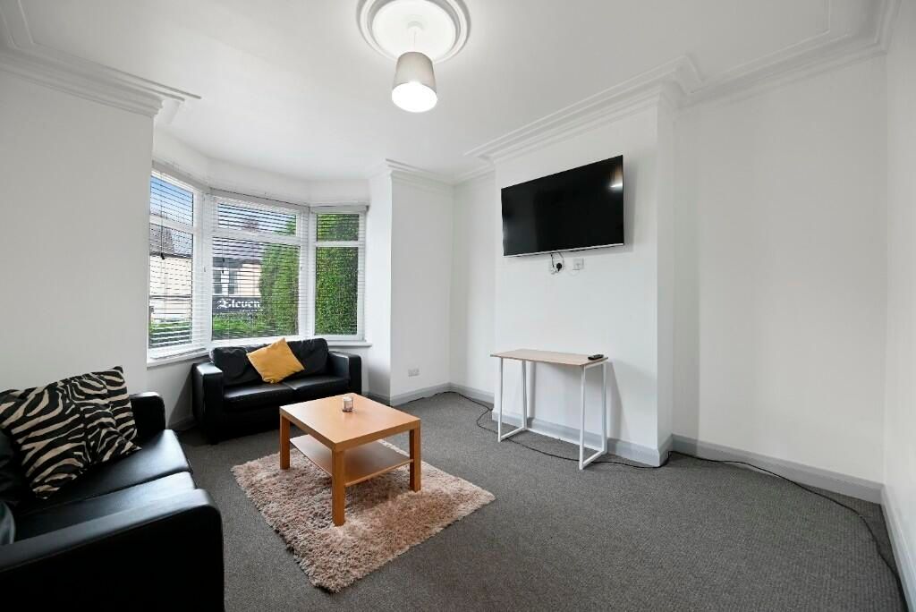 Property photo 3 of 15 A Bright And Welcoming Living Room Featuring Large...