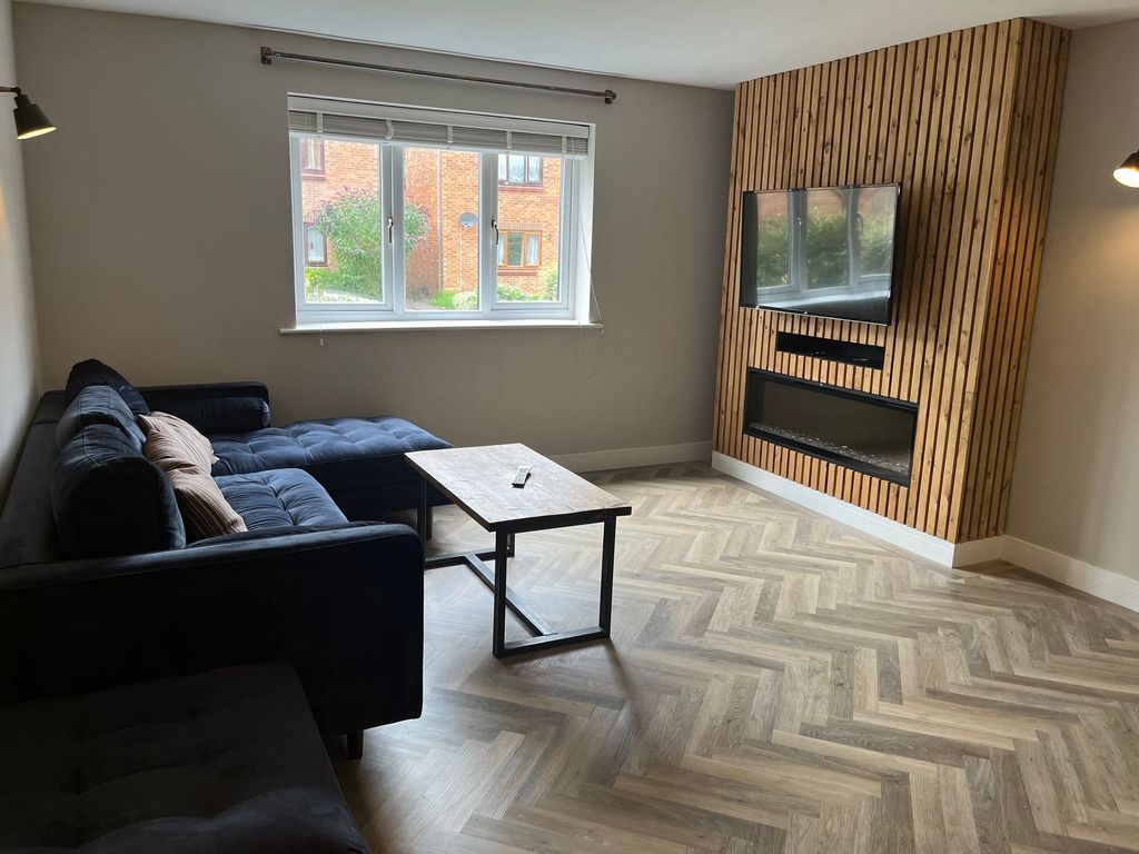 Property photo 1 of 6 A Modern Living Room Featuring A Large Window Prov...