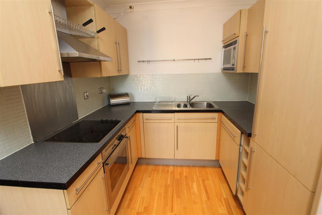 Property photo 2 of 11 Bright Kitchen With Ample Workspace And Storage...
