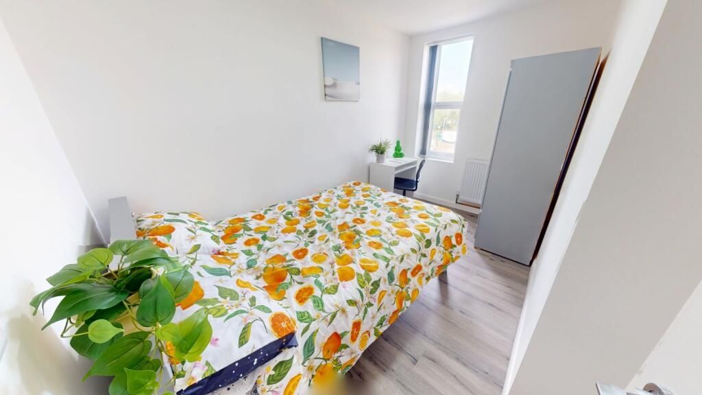 Property photo 1 of 12 Bright And Airy Bedroom Featuring A Comfortable Do...