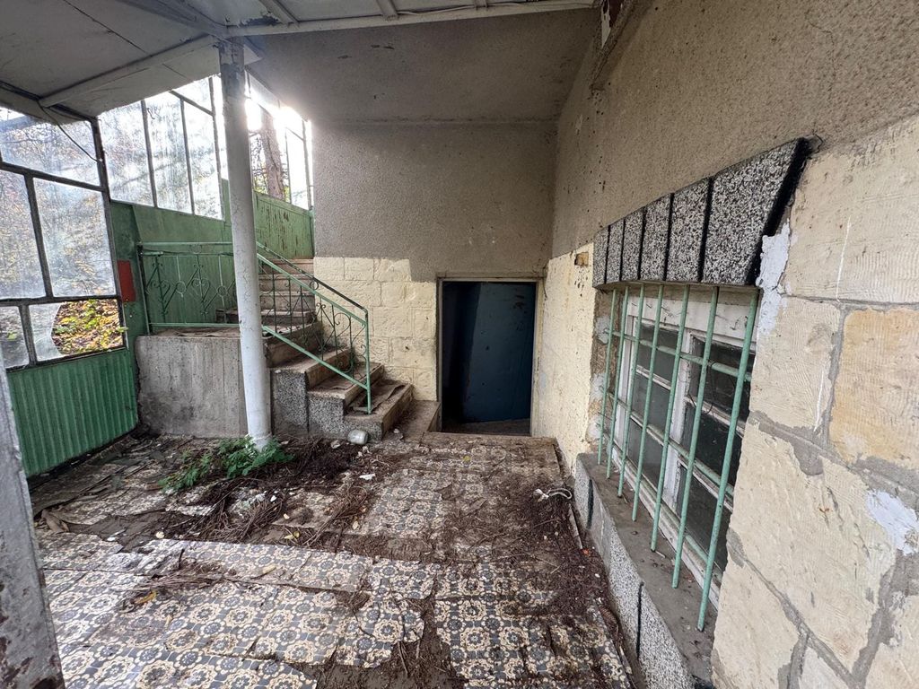 Property photo 2 of 25 Covered Entrance Showing Patterned Tiled Floor, Stairs Leading To Upper And Lower Levels, And Barred Windows