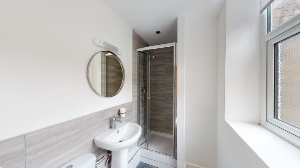Property photo 3 of 6 Bright And Clean Bathroom Featuring A Modern Corne...