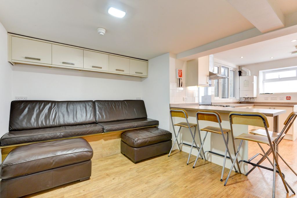 Property photo 3 of 26 A Modern Living Room Featuring A Sleek Leather Sof...