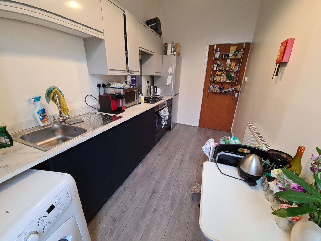 Property photo 3 of 10 Bright And Modern Kitchen Featuring Ample Counter ...