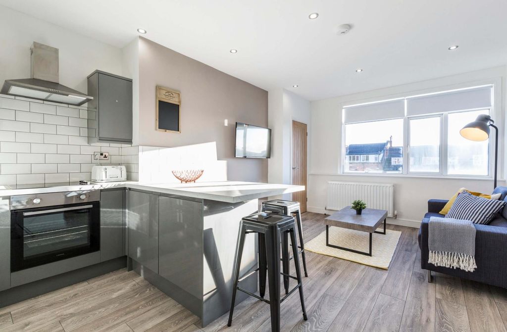 Property photo 2 of 7 A Bright, Modern Living Room With Ample Natural li...